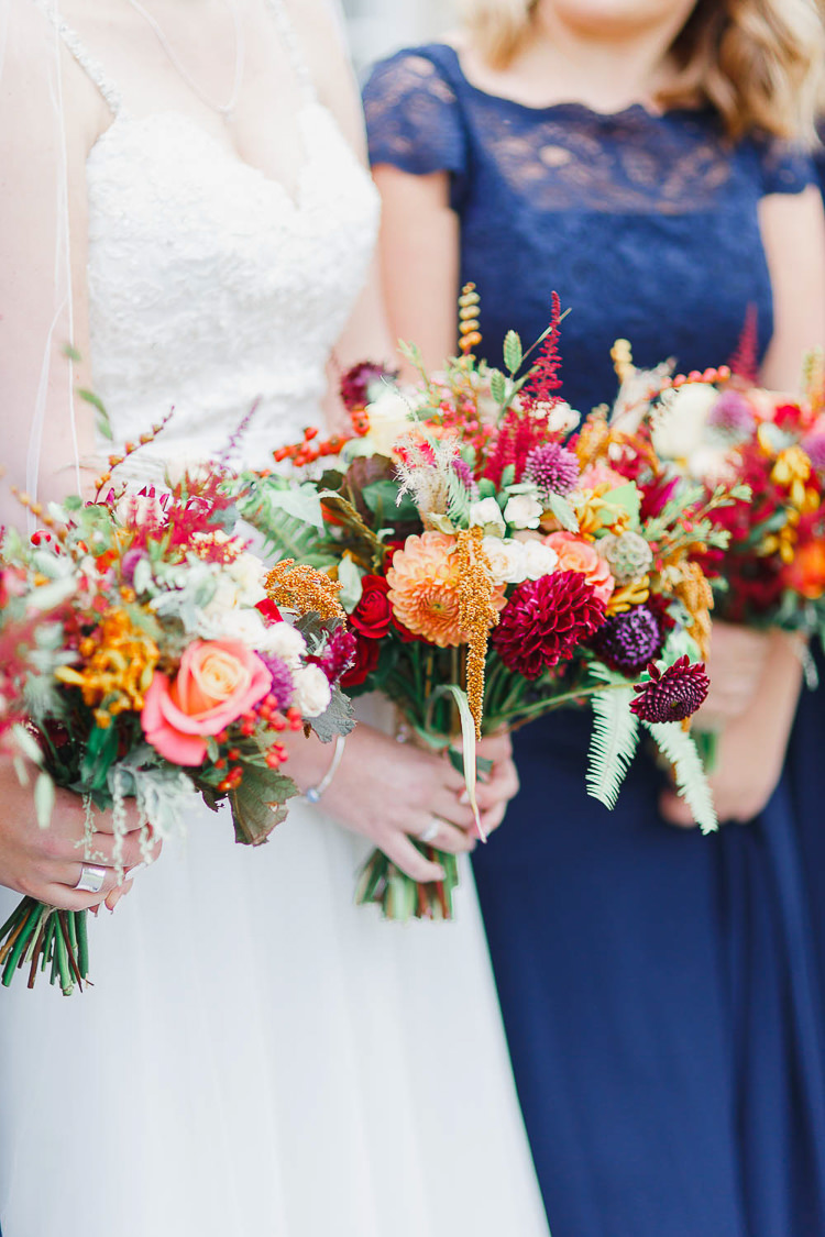 Bouquet Flowers Red Orange Dahlia Rose Bride Bridal Berry Bridesmaids Magical Fairy Lit Autumn Barn Wedding http://whitestagweddings.com/