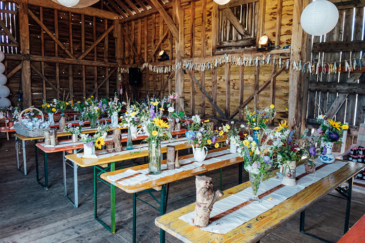 Ribbon Bunting Wild Flowers Bottles Tables Decor Fun DIY Barn Farm Summer Wedding http://www.annapumerphotography.com/