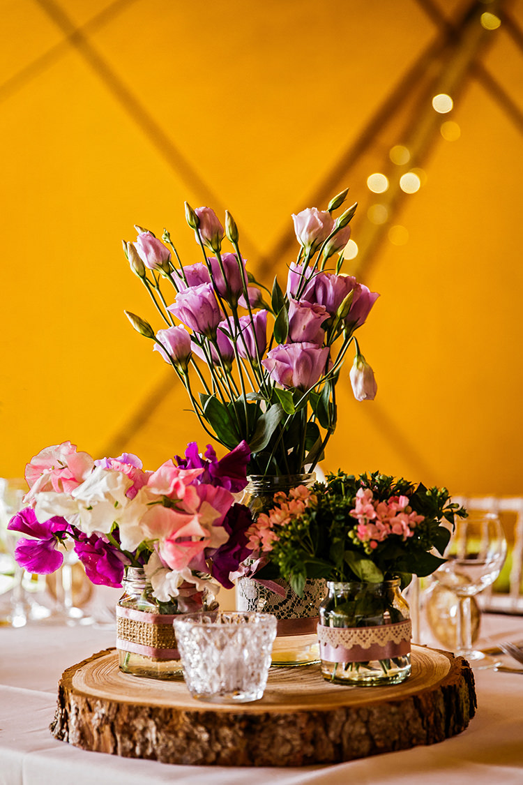 Flower Centrepiece Log Decor Jars Hessian Ribbon Pink Pretty Outdoorsy Garden Rustic Tipi Wedding http://alexabbottphotography.co.uk/