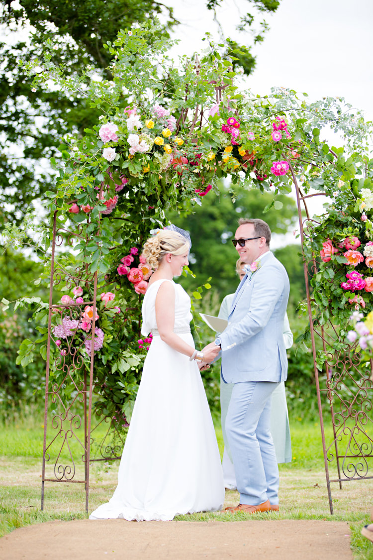 Flower Arch Floral Outdoor Ceremony UK Colourful Pastel Home Made Farm Wedding http://helencawtephotography.com/