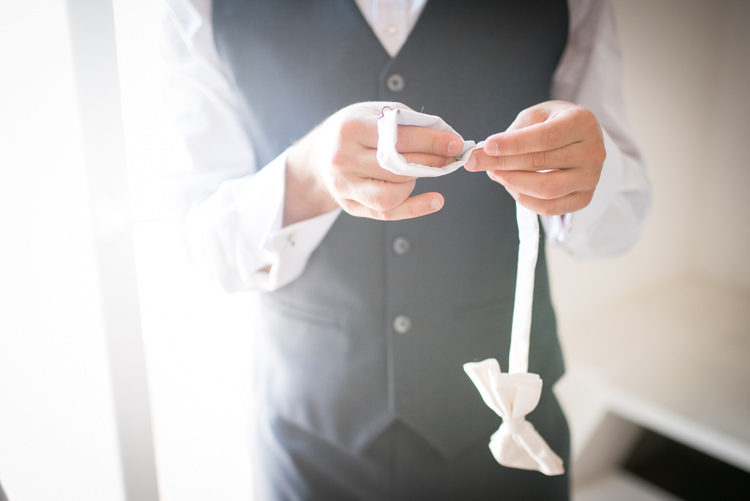 Groom White Shirt Black Vest White Bowtie Getting Ready Romantic Outdoor Castle Tuscany Wedding http://www.natalymontanari.com/