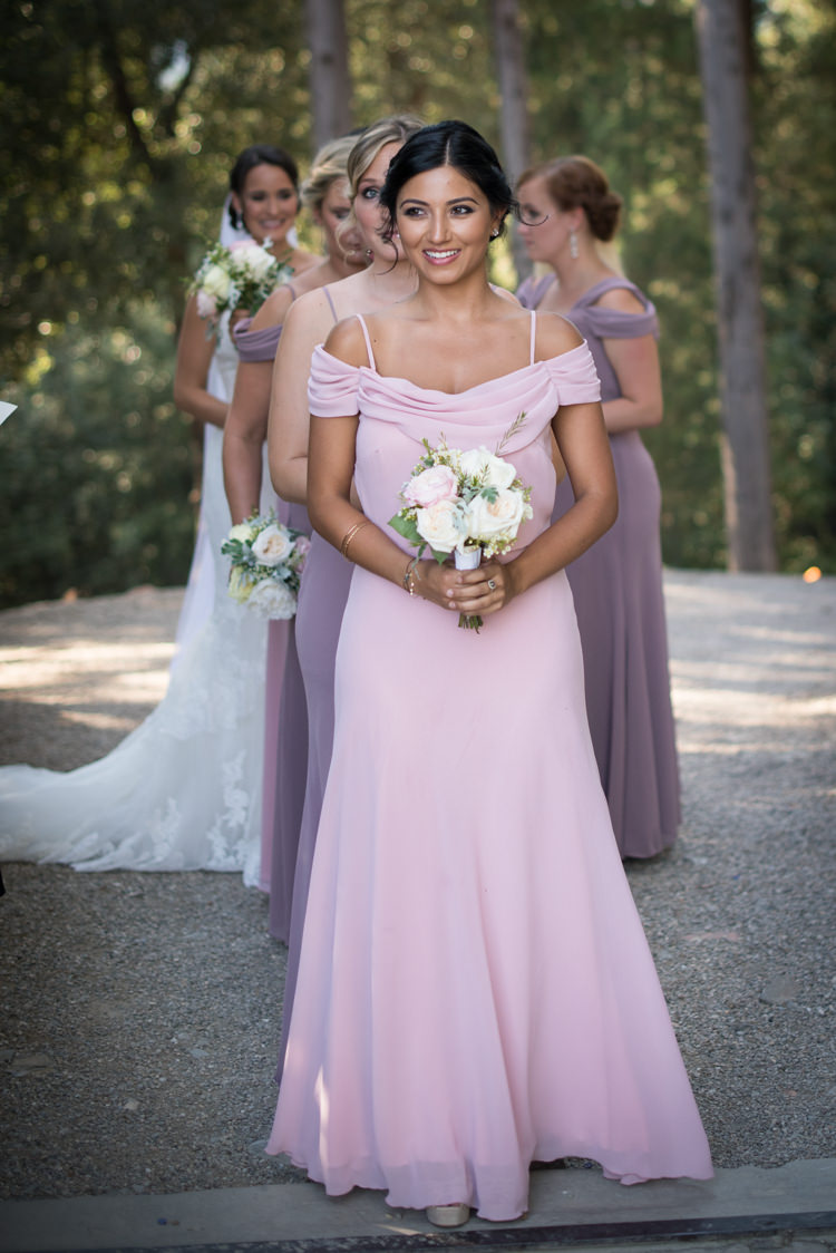 Ceremony Entrance Bridesmaids Soft Pink Purple Dresses Bouquet White Pink Rose Peony Flowers Bride Fitted Lace Mermaid Bridal Gown Veil Romantic Outdoor Castle Tuscany Wedding http://www.natalymontanari.com/