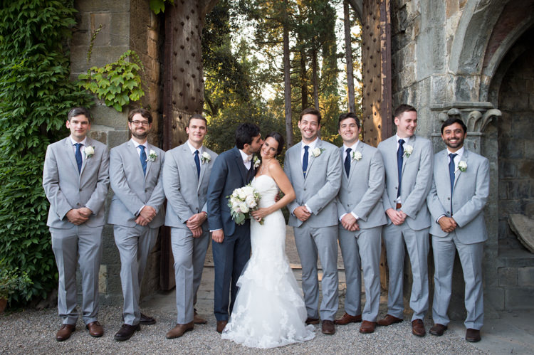 Bride Fitted Lace Mermaid Bridal Gown Bouquet Groom Black Suit White Bowtie Floral Buttonhole Groomsmen Grey Suits Blue Ties Brown Shoes Romantic Outdoor Castle Tuscany Wedding http://www.natalymontanari.com/