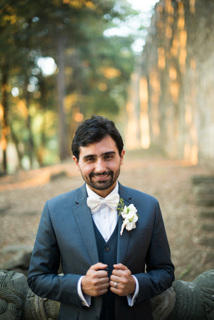 Groom Black Suit White Shirt White Bowtie White Floral Buttonhole Romantic Outdoor Castle Tuscany Wedding http://www.natalymontanari.com/