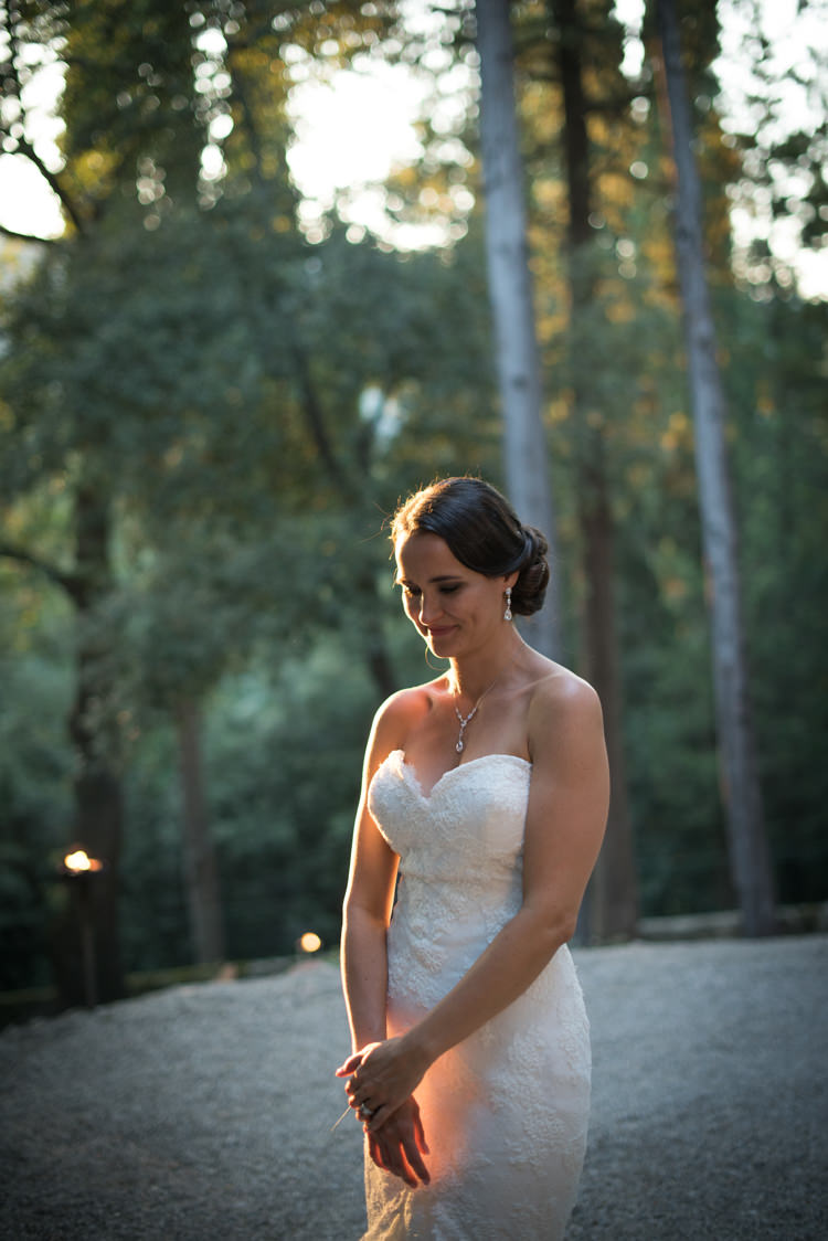 Bride Fitted Lace Mermaid Bridal Gown Soft Bun Hairstyle Crystal Earrings Necklace Romantic Outdoor Castle Tuscany Wedding http://www.natalymontanari.com/