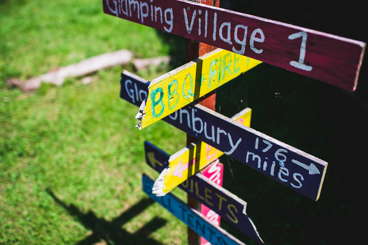 Wooden Painted Sign Post Fun Festival Glamping Wedding https://storry.co.uk/