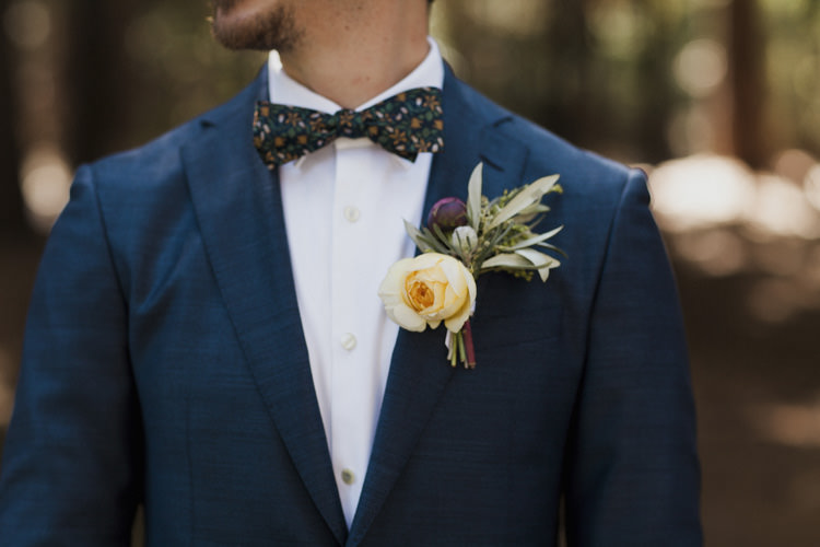 Groom Dark Blue Suit White Shirt Patterned Bowtie Floral Buttonhole Yellow Rose Greenery Whimsical Forest Harry Potter Wedding http://heatherelizabethphotography.com/