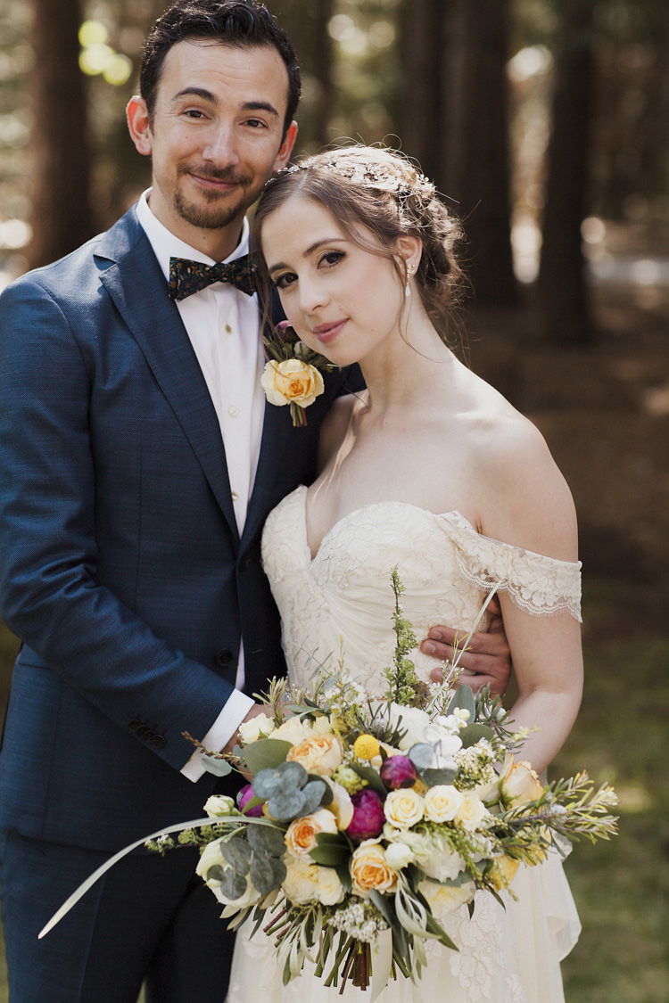 First Look Bride Sarah Seven Cascade Lace Off The Shoulder Bridal Gown Crystal Hairpiece Multicoloured Bouquet Cream Yellow Pink Green Roses Peonies Groom Dark Blue Suit Patterned Bowtie Floral Buttonhole Whimsical Forest Harry Potter Wedding http://heatherelizabethphotography.com/