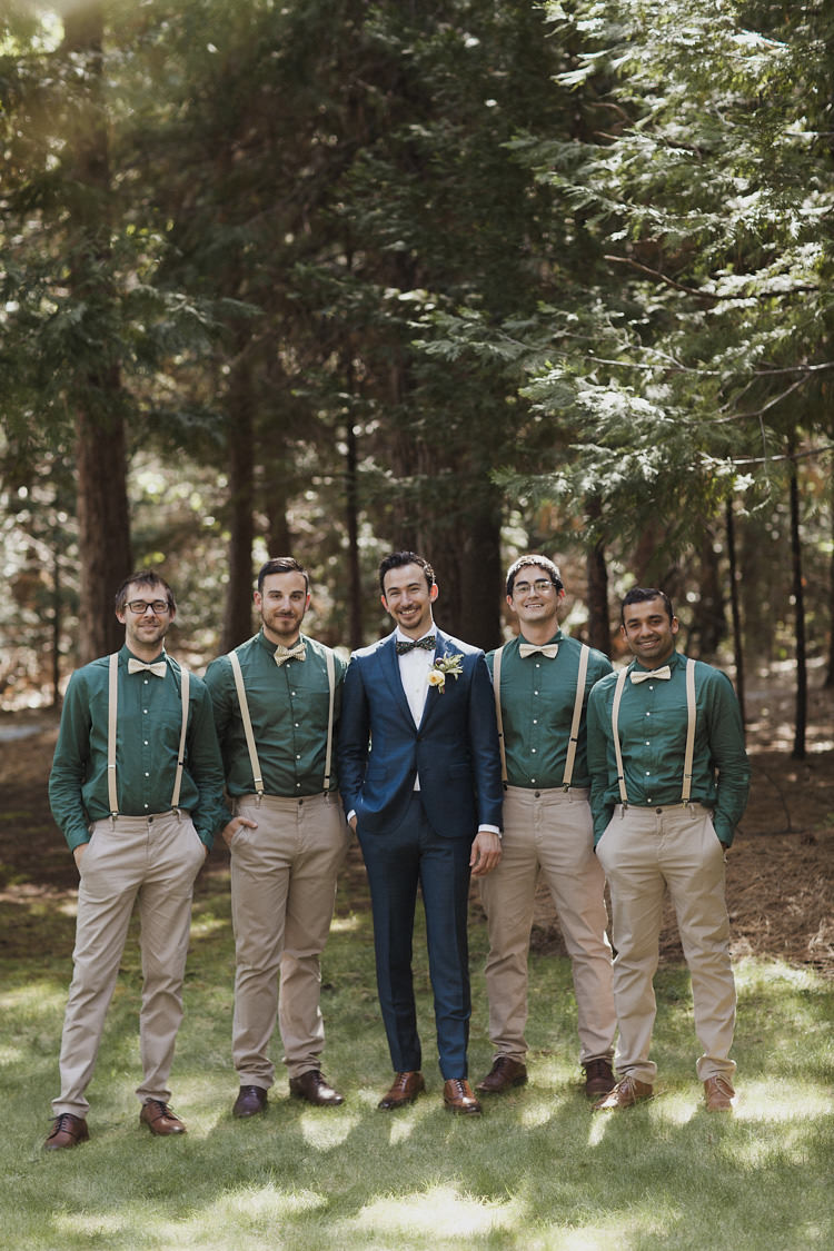 Groom Dark Blue Suit White Shirt Patterned Bowtie Floral Buttonhole Groomsmen Green Shirts Beige Pants Suspenders Bowties Whimsical Forest Harry Potter Wedding http://heatherelizabethphotography.com/