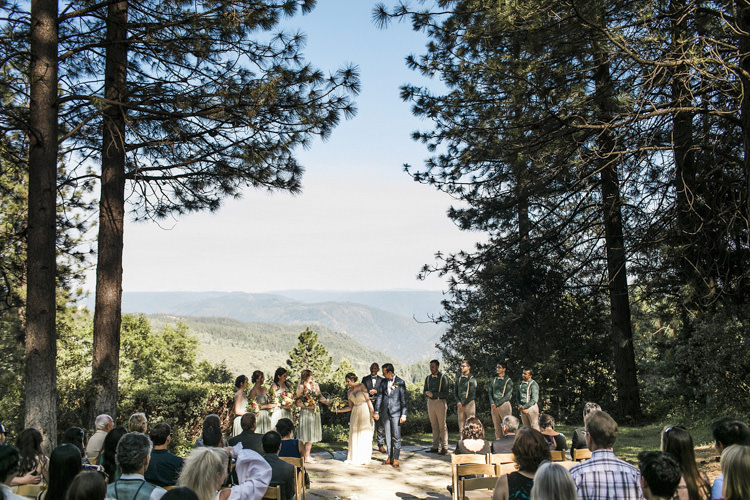 Outdoor Ceremony Bride Sarah Seven Cascade Lace Off The Shoulder Bridal Gown Crystal Hairpiece Groom Dark Blue Suit Patterned Bowtie Floral Buttonhole Bridesmaids Groomsmen Guests Whimsical Forest Harry Potter Wedding http://heatherelizabethphotography.com/