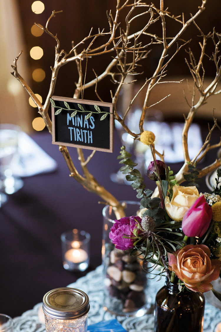 Reception Table Setting Book Lover Theme Painted Branches Blackboard Dark Bottle Multicoloured Florals Candles Whimsical Forest Harry Potter Wedding http://heatherelizabethphotography.com/