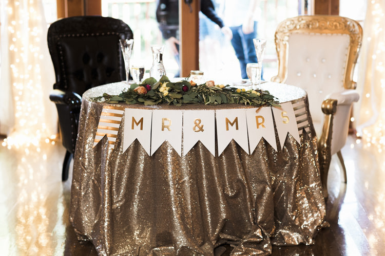 Reception Table Setting Bride Groom Table Metallic Sequin Tablecloth Mr Mrs Bunting Florals Greenery Vintage Chairs Whimsical Forest Harry Potter Wedding http://heatherelizabethphotography.com/