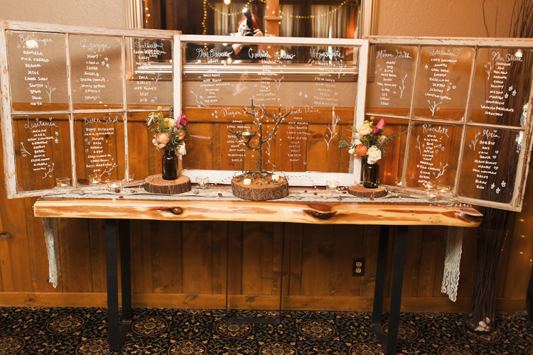 Reception Table Seating Chart Clear Glass Handwritten Names Dark Bottles Multicoloured Florals Candles Whimsical Forest Harry Potter Wedding http://heatherelizabethphotography.com/
