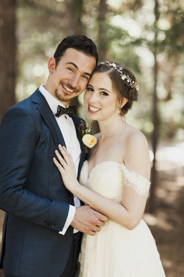 First Look Bride Sarah Seven Cascade Lace Off The Shoulder Bridal Gown Embellished Belt Crystal Hairpiece Groom Dark Blue Suit Patterned Bowtie Floral Buttonhole Whimsical Forest Harry Potter Wedding http://heatherelizabethphotography.com/