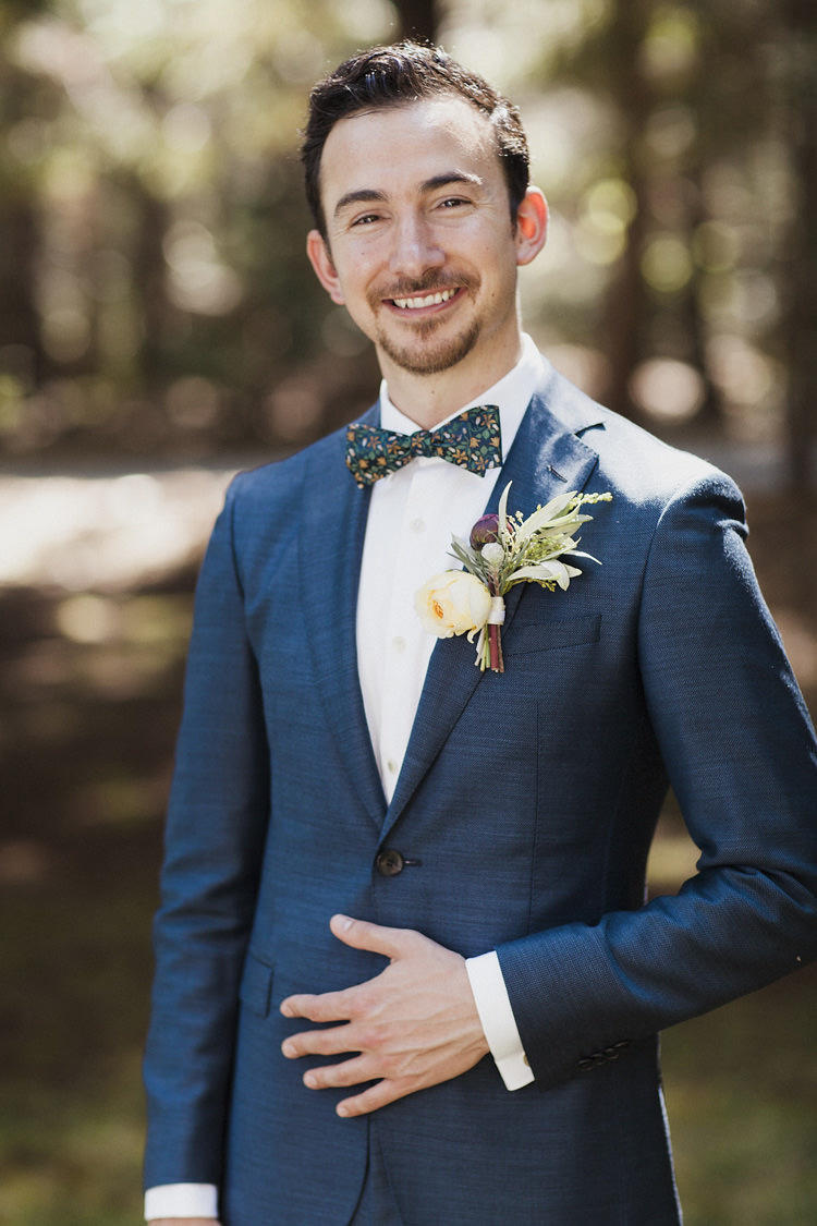 Groom Dark Blue Suit White Shirt Patterned Bowtie Floral Buttonhole Yellow Rose Greenery Whimsical Forest Harry Potter Wedding http://heatherelizabethphotography.com/