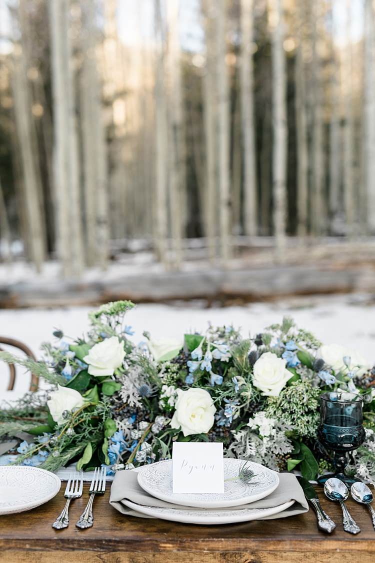 Outdoor Reception Wooden Table Setting Calligraphy Name Card Fresh White Blue Green Florals Roses Snowy Winter Wonderland Anniversary Shoot http://ryannlindseyphotography.com/