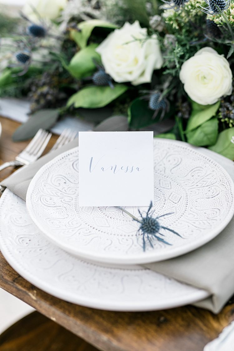 Outdoor Reception Wooden Table Calligraphy Name Card Patterned Plates Fresh White Blue Green Florals Snowy Winter Wonderland Anniversary Shoot http://ryannlindseyphotography.com/