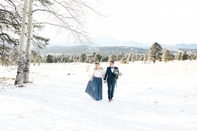 Bride Lace Off The Shoulder Top Blue Long Skirt Floral Crown Bouquet White Blue Green Flowers Groom Blue Suit Navy Polka Dot Bowtie Snowy Winter Wonderland Anniversary Shoot http://ryannlindseyphotography.com/