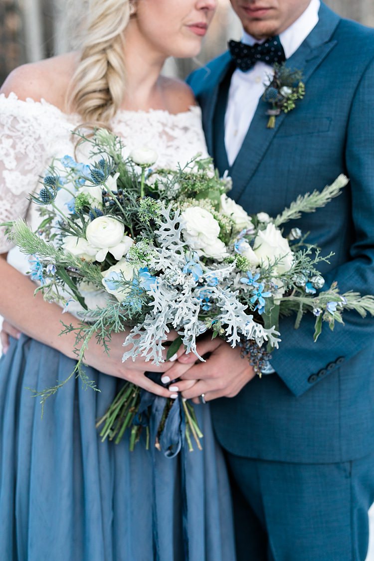 Bride Lace Off The Shoulder Top Blue Long Skirt Floral Crown Bouquet White Blue Green Flowers Groom Blue Suit Navy Polka Dot Bowtie Snowy Winter Wonderland Anniversary Shoot http://ryannlindseyphotography.com/