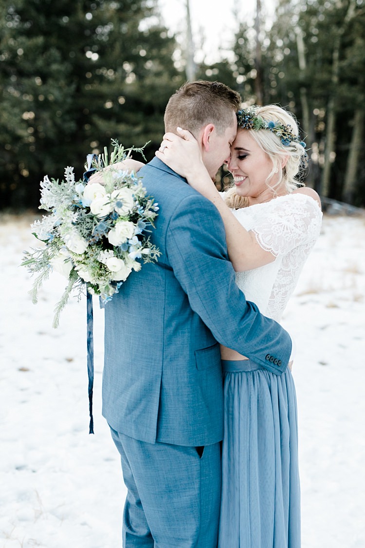 Bride Lace Off The Shoulder Top Blue Long Skirt Floral Crown Bouquet White Blue Green Flowers Groom Blue Suit Navy Polka Dot Bowtie Snowy Winter Wonderland Anniversary Shoot http://ryannlindseyphotography.com/