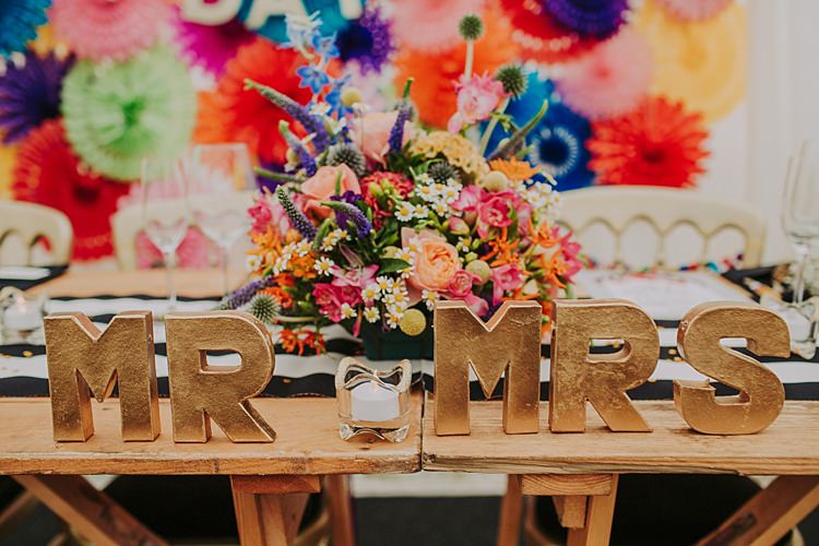 MR MRS Sign Table Decor Top Colourful Indie Dinosaur Wedding http://bloomweddings.co.uk/