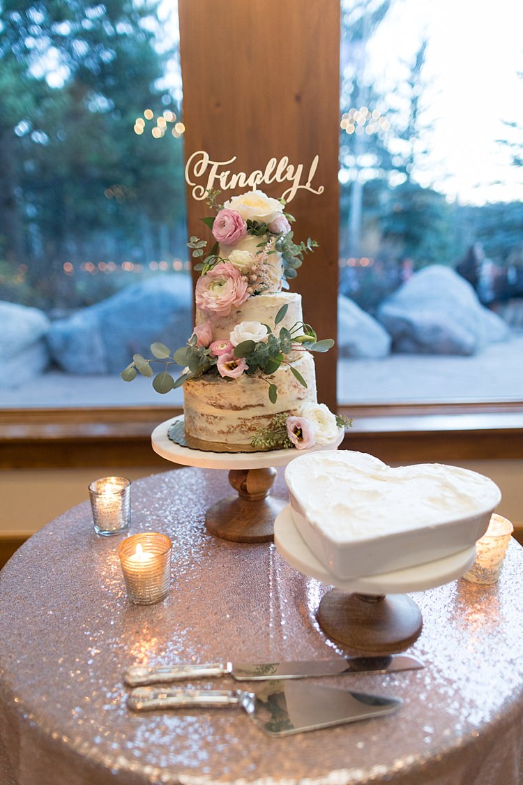 Reception Naked Wedding Cake Pale Pink Florals Finally Cake Topper Wooden Stand Love Heart White Cake Sequinned Tablecloth Candles Romantic Mountain Wedding Colorado http://irvingphotographydenver.com/