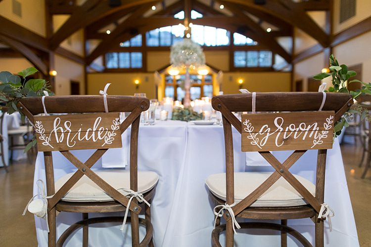 Reception Table Setting Wooden Chairs Wooden Bride Groom Signs White Ribbons White Calligraphy Greenery Romantic Mountain Wedding Colorado http://irvingphotographydenver.com/