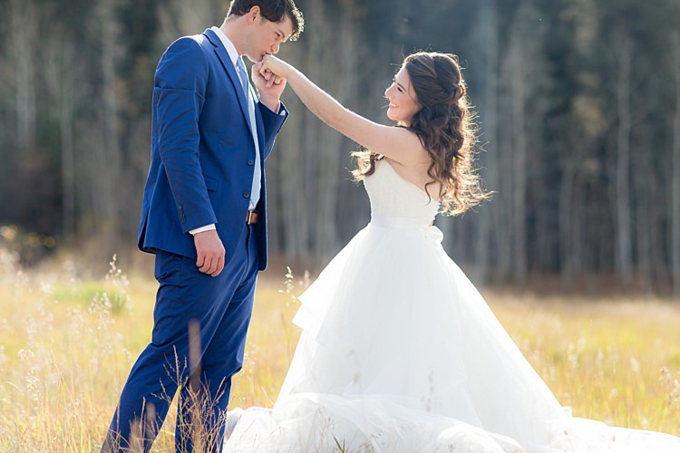 Bride Strapless Lace Ballgown Bridal Gown Loose Curls Hairstyle Groom Blue Suit White Shirt Light Blue Tie Romantic Mountain Wedding Colorado http://irvingphotographydenver.com/