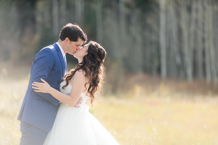 Bride Strapless Lace Ballgown Bridal Gown Loose Curls Hairstyle Groom Blue Suit White Shirt Light Blue Tie Romantic Mountain Wedding Colorado http://irvingphotographydenver.com/