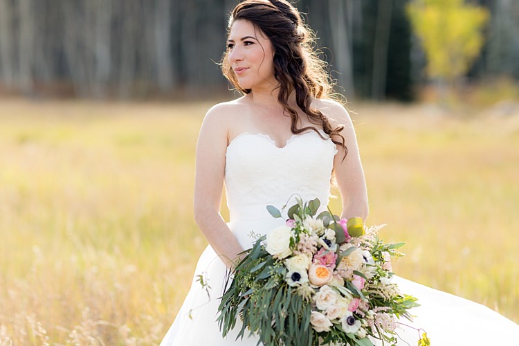 Bride Strapless Lace Ballgown Bridal Gown Bouquet Multicoloured Pastel Roses Peonies Anemones Greenery Loose Curls Hairstyle Soft Makeup Romantic Mountain Wedding Colorado http://irvingphotographydenver.com/