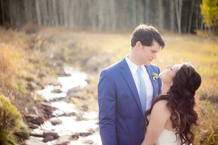 Bride Strapless Lace Ballgown Bridal Gown Loose Curls Hairstyle Groom Blue Suit White Shirt Light Blue Tie Romantic Mountain Wedding Colorado http://irvingphotographydenver.com/