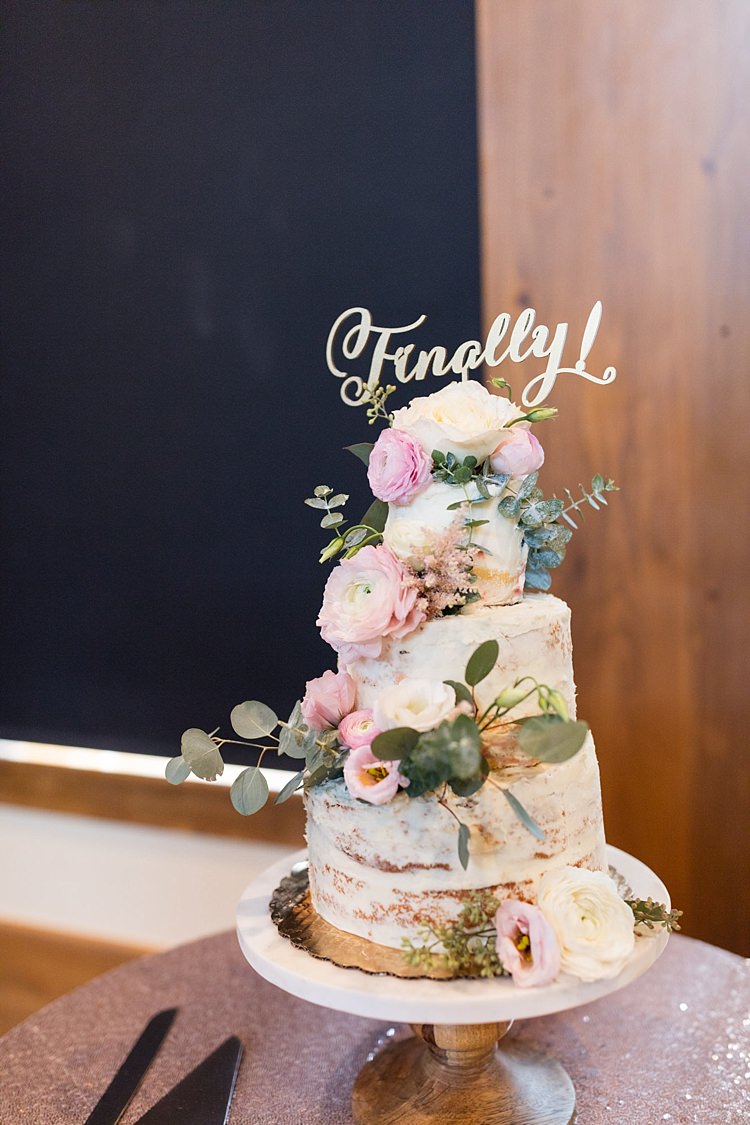 Reception Naked Wedding Cake Pale Pink Florals Greenery Finally Cake Topper Wooden Stand Sequinned Tablecloth Romantic Mountain Wedding Colorado http://irvingphotographydenver.com/