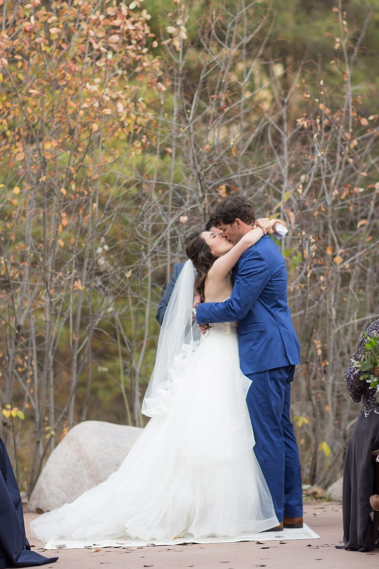 Outdoor Ceremony Bride Strapless Lace Ballgown Bridal Gown Veil Groom Blue Suit Tan Shoes The Kiss Autumn Trees Romantic Mountain Wedding Colorado http://irvingphotographydenver.com/