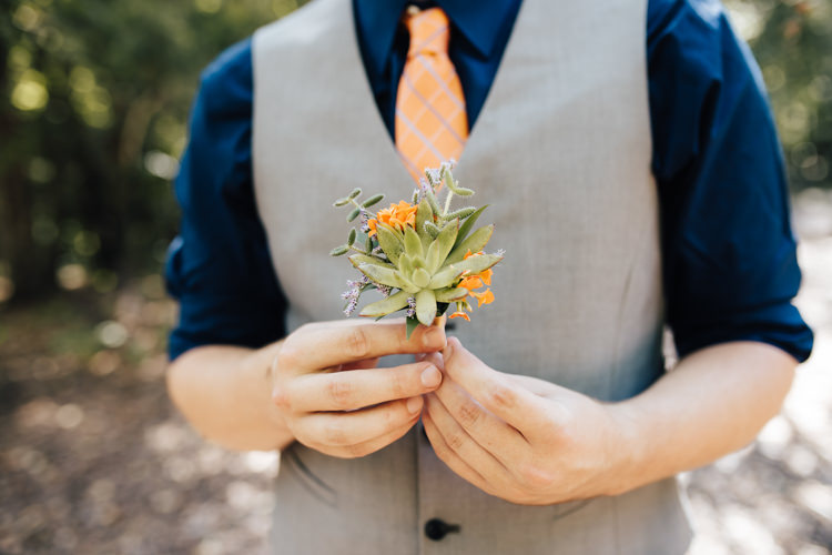Groom Grey Vest Navy Blue Shirt Orange Checkered Tie Buttonhole Orange Florals Succulent Greenery Adventure Inspired Woodland Wedding North Carolina http://www.amandasuttonphotography.com/