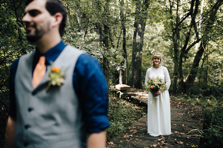 Outdoor First Look Bride Handmade Lace Floral Belt Bridal Gown Bouquet Groom Grey Vest Navy Blue Shirt Orange Checkered Tie Buttonhole Orange Florals Succulent Adventure Inspired Woodland Wedding North Carolina http://www.amandasuttonphotography.com/