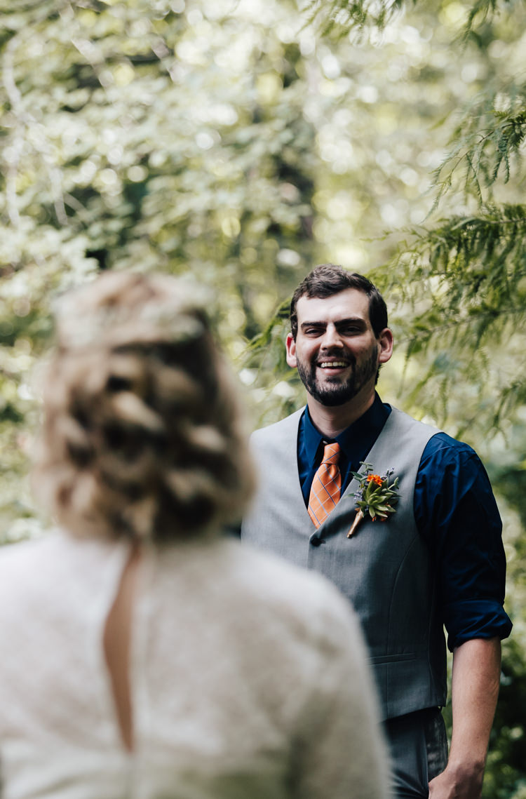 Outdoor First Look Bride Handmade Lace Bridal Gown Groom Grey Vest Pants Navy Blue Shirt Orange Checkered Tie Buttonhole Orange Florals Succulent Adventure Inspired Woodland Wedding North Carolina http://www.amandasuttonphotography.com/