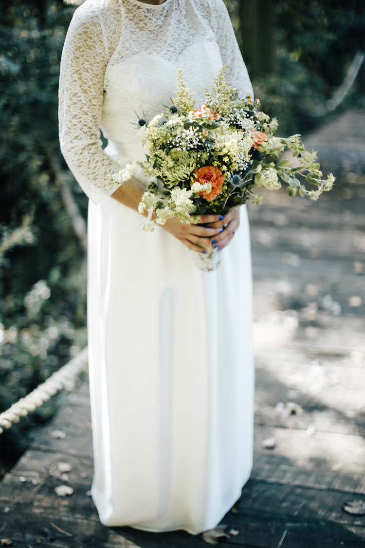 Bride Handmade Lace Floral Belt Bridal Gown Bouquet Orange Carnations Thistle Gypsophila Lace Ribbon Adventure Inspired Woodland Wedding North Carolina http://www.amandasuttonphotography.com/