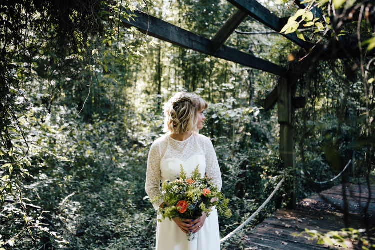Bride Handmade Lace Floral Belt Bridal Gown Bouquet Orange Carnations Thistle Gypsophila Lace Ribbon Adventure Inspired Woodland Wedding North Carolina http://www.amandasuttonphotography.com/