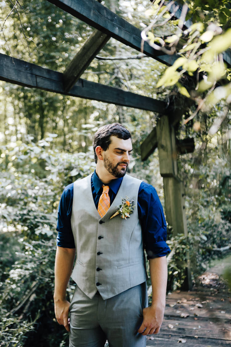 Groom Grey Vest Pants Navy Blue Shirt Orange Checkered Tie Buttonhole Orange Florals Greenery Succulent Adventure Inspired Woodland Wedding North Carolina http://www.amandasuttonphotography.com/