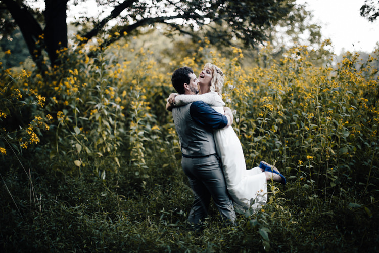 Bride Handmade Lace Floral Belt Bridal Gown Blue Flat Shoes Groom Grey Vest Pants Navy Blue Shirt Yellow Flowers Adventure Inspired Woodland Wedding North Carolina http://www.amandasuttonphotography.com/