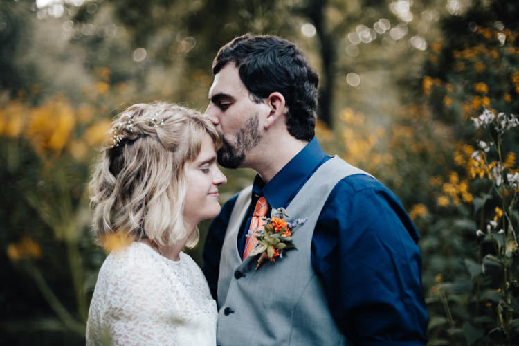 Bride Handmade Lace Floral Belt Bridal Gown Groom Grey Vest Pants Navy Blue Shirt Orange Checkered Tie Buttonhole Orange Florals Greenery Succulent Yellow Flowers Adventure Inspired Woodland Wedding North Carolina http://www.amandasuttonphotography.com/