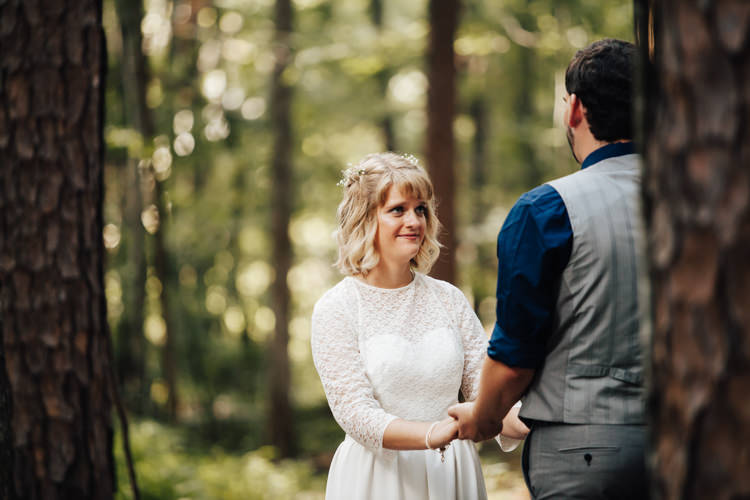 Outdoor Ceremony Bride Handmade Lace Bridal Gown Groom Grey Vest Pants Navy Blue Shirt Adventure Inspired Woodland Wedding North Carolina http://www.amandasuttonphotography.com/