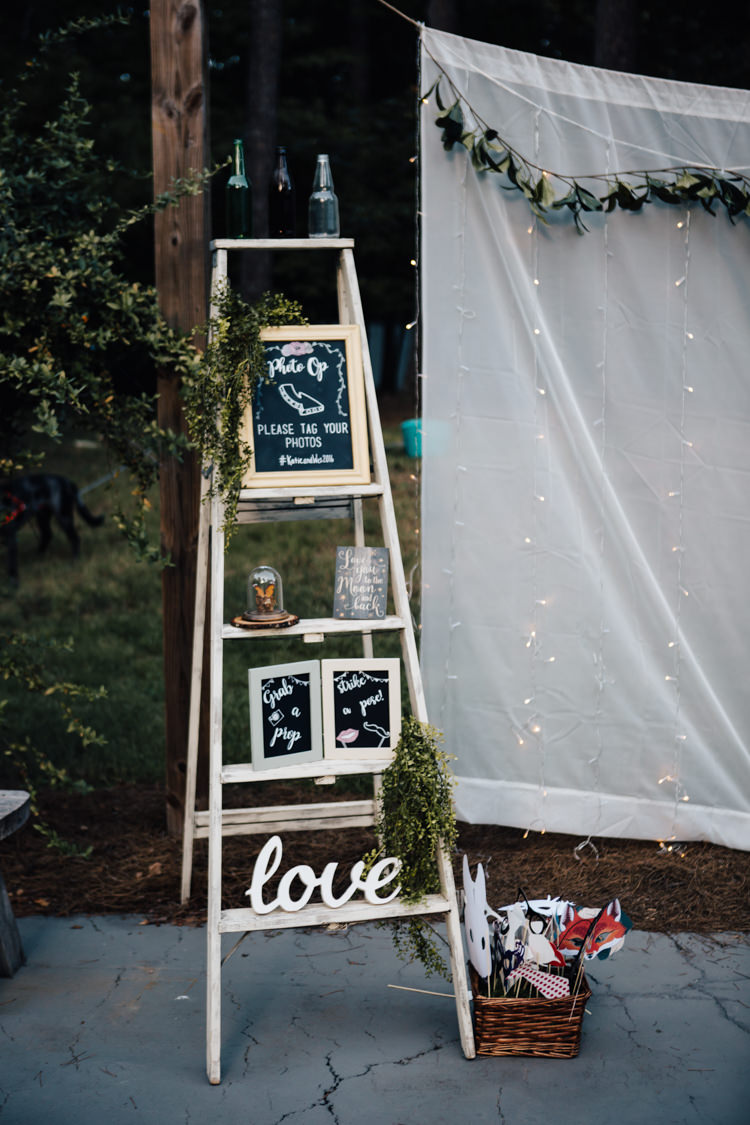 Reception DIY Photo Booth Ladder Blackboard Sign Props Fairy Lights Adventure Inspired Woodland Wedding North Carolina http://www.amandasuttonphotography.com/