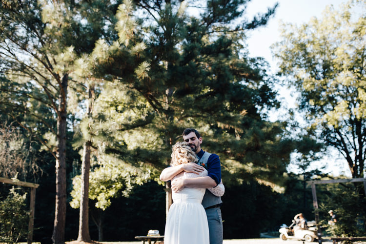 Bride Handmade Lace Bridal Gown Groom Grey Vest Pants Navy Blue Shirt Orange Checkered Tie Adventure Inspired Woodland Wedding North Carolina http://www.amandasuttonphotography.com/