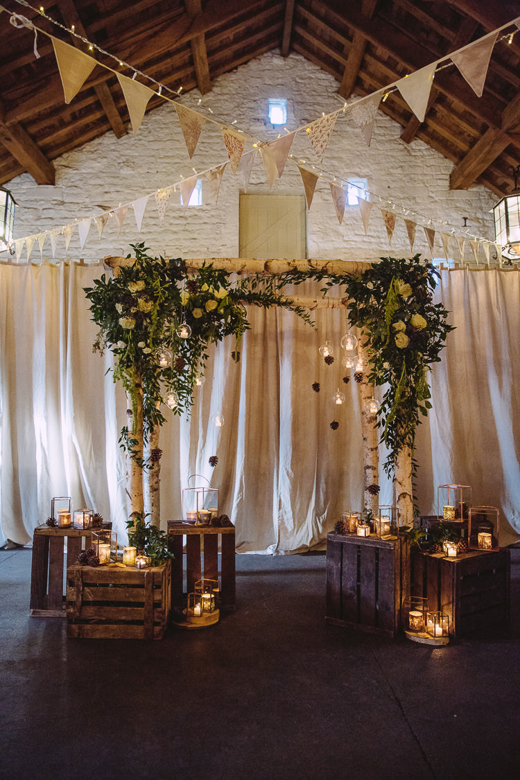 Aisle Ceremony Backdrop Arbour Candles Crates Branches Flowers Bunting Magical Winter Rustic Wonderland Wedding http://hayleybaxterphotography.com/