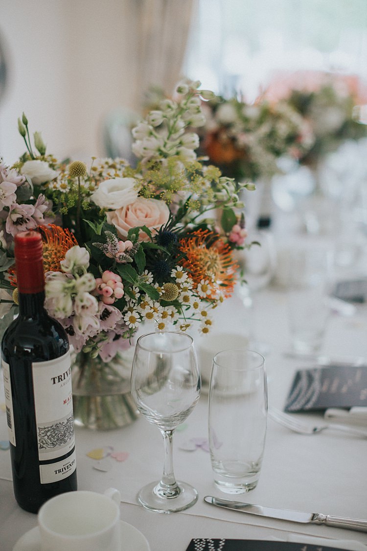 Table Flowers Natural Wild Pink Yellow Rose Daisy Billy Ball Thistle Berries Whimsical Seaside Wedding Pale Pink Dress http://devlinphotos.co.uk/