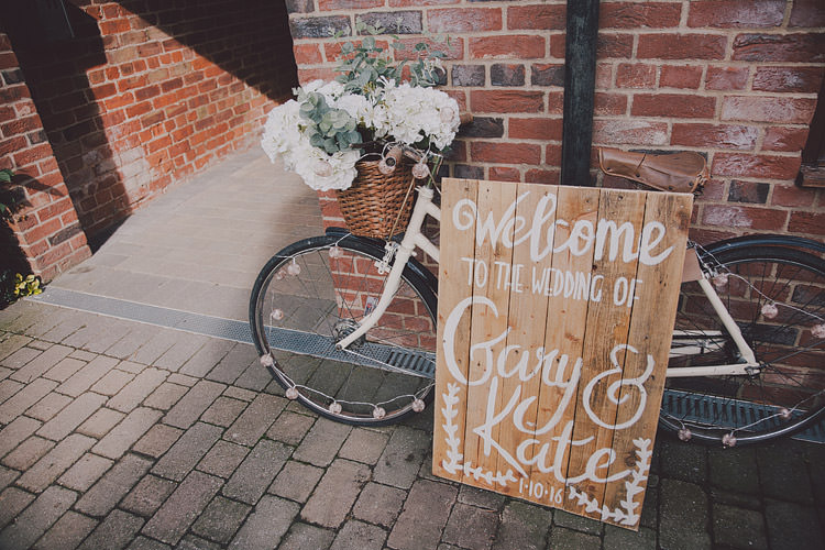 Bicycle Decor Flowers Sign Basket Wooden Chic Rustic Grey Barn Wedding http://www.kevelkinsphotography.co.uk/ 