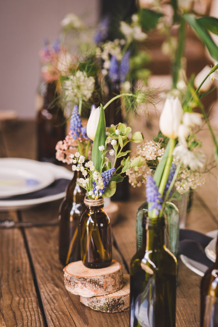 Bottle Flowers Logs Decor Magical Spring Bluebell Woodland Wedding Ideas http://helinebekker.co.uk/