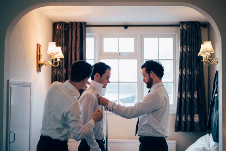Groom DKNY Suit Moss Bros Heartwarming Festive Winter Wedding http://www.nikkivandermolen.com/