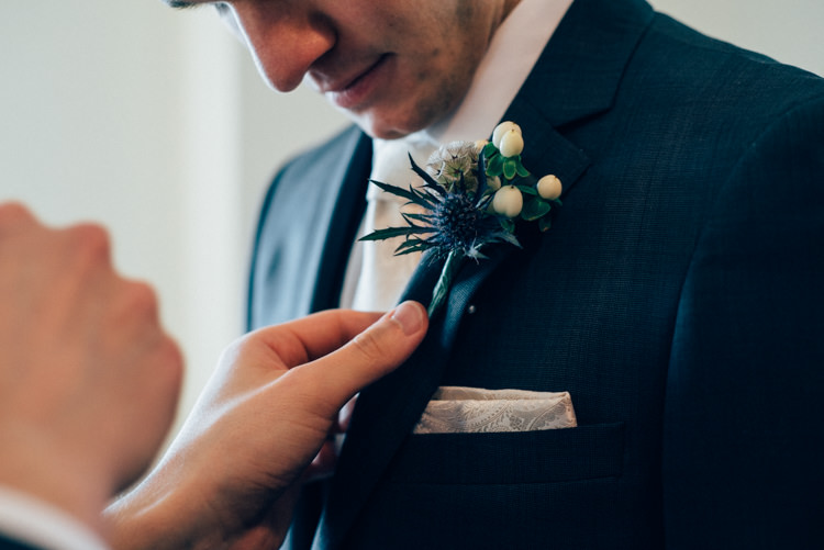 Groom DKNY Suit Moss Bros Buttonhole Thistle Heartwarming Festive Winter Wedding http://www.nikkivandermolen.com/